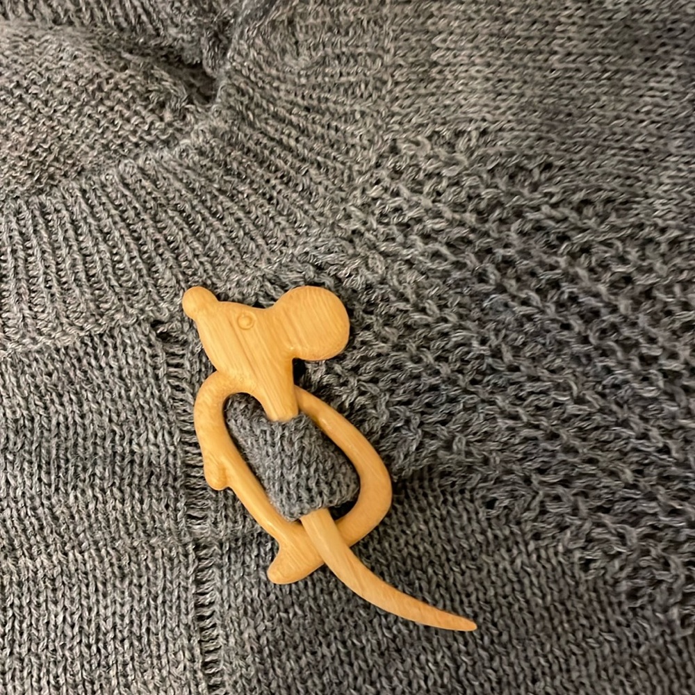 Wooden mouse sweater pin.